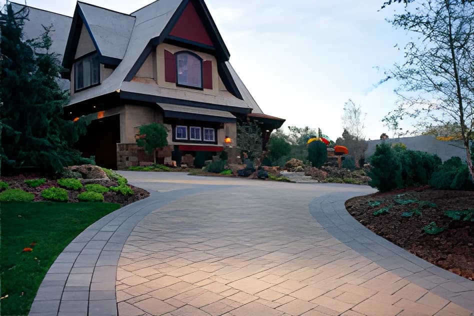 A finished concrete paver driveway by Black Diamond Paver Stones & Landscape