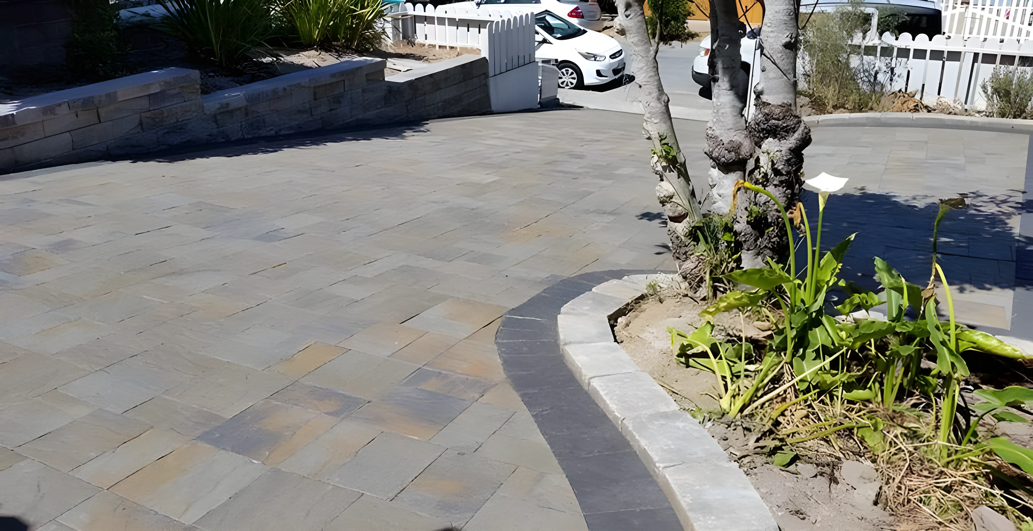 Curved stone driveway with charcoal edge