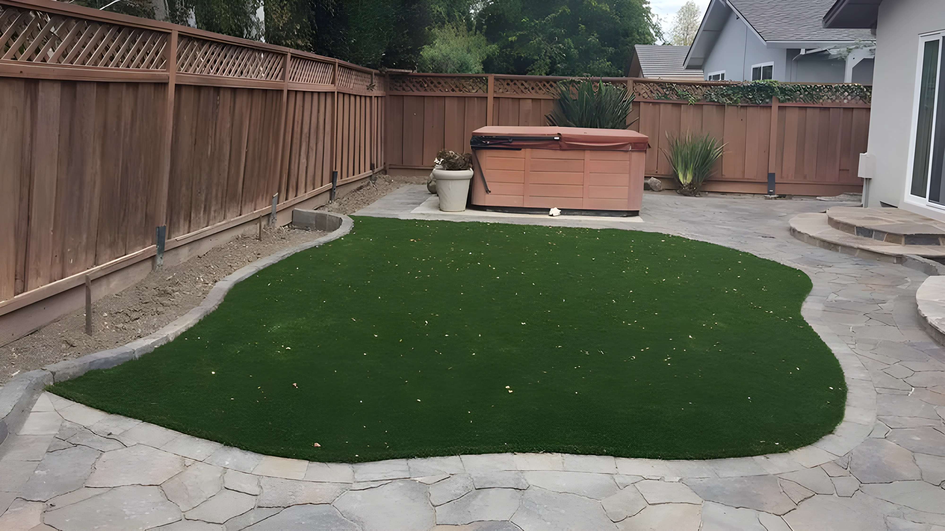 Synthetic lawn and paver patio